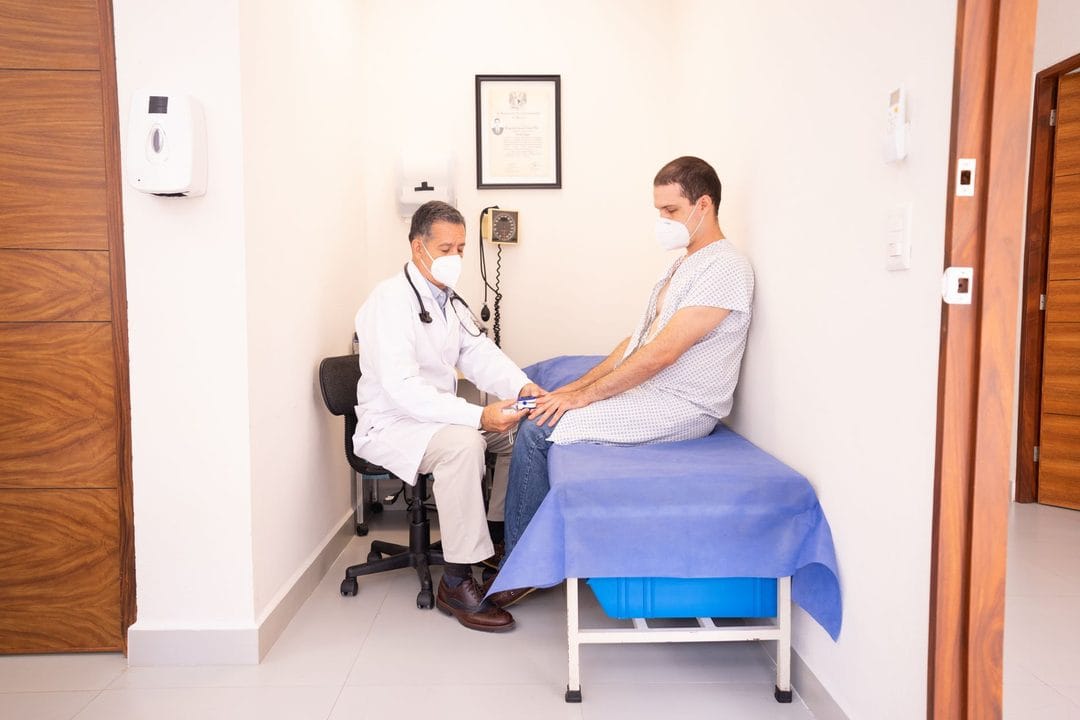 Doctor consulting with a male patient